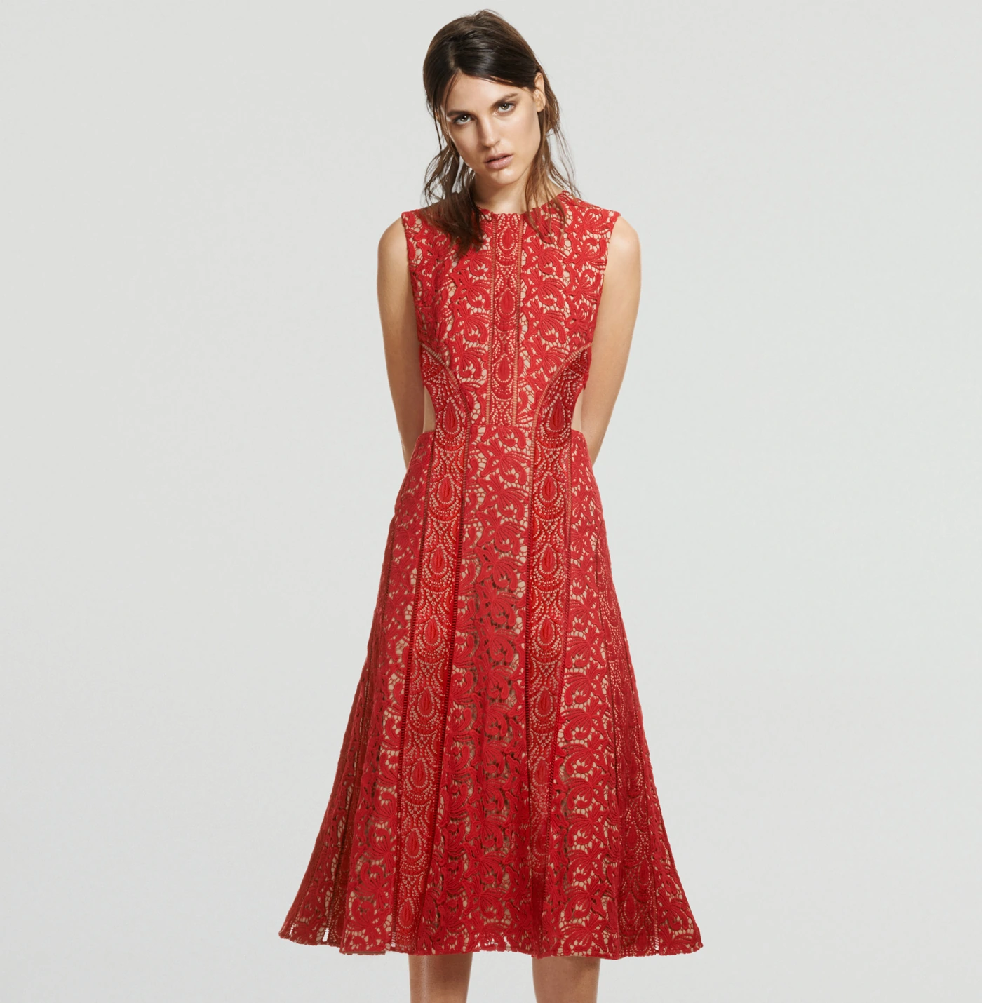 The red lace dress in the original composed studio portrait.